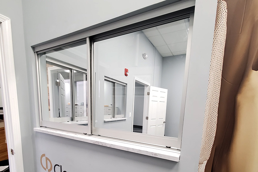 Chicago Glass Sliding Showcase Doors and Office Pass-Thru Windows